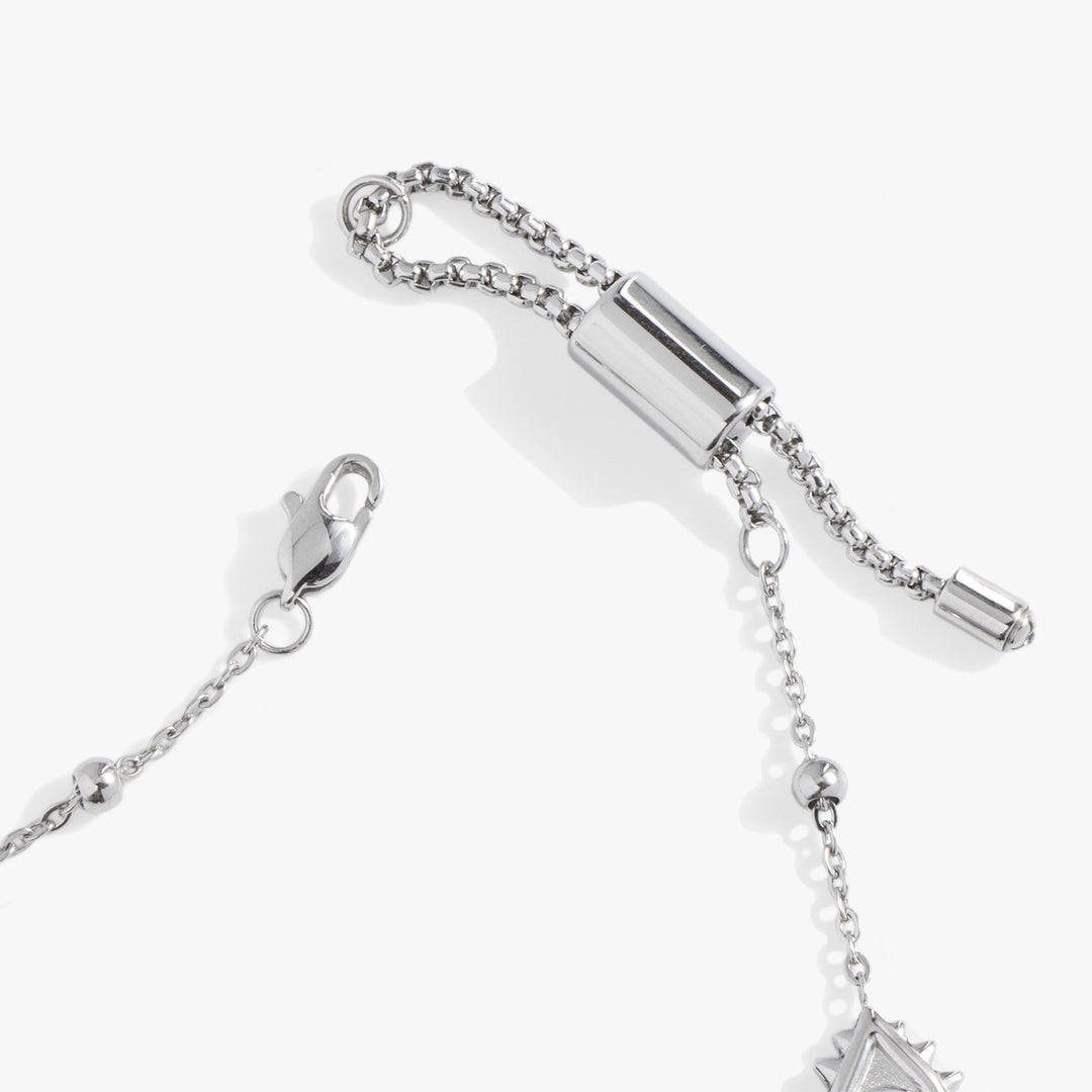 Silver bracelet with chain and clasp on a white background