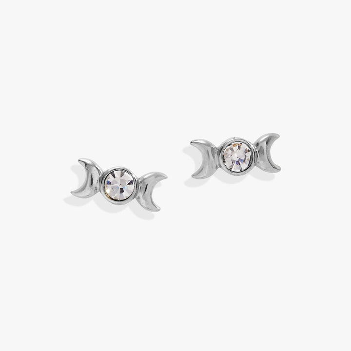 Pair of silver triple goddess earrings with crystal elements on a white background