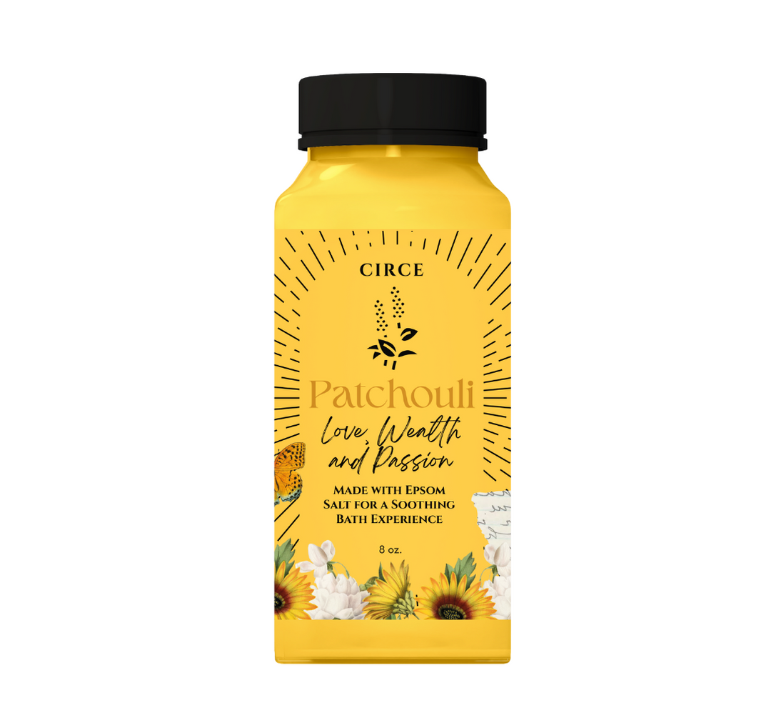 Yellow bottle of Circe Patchouli bath salt with black lid on a white background
