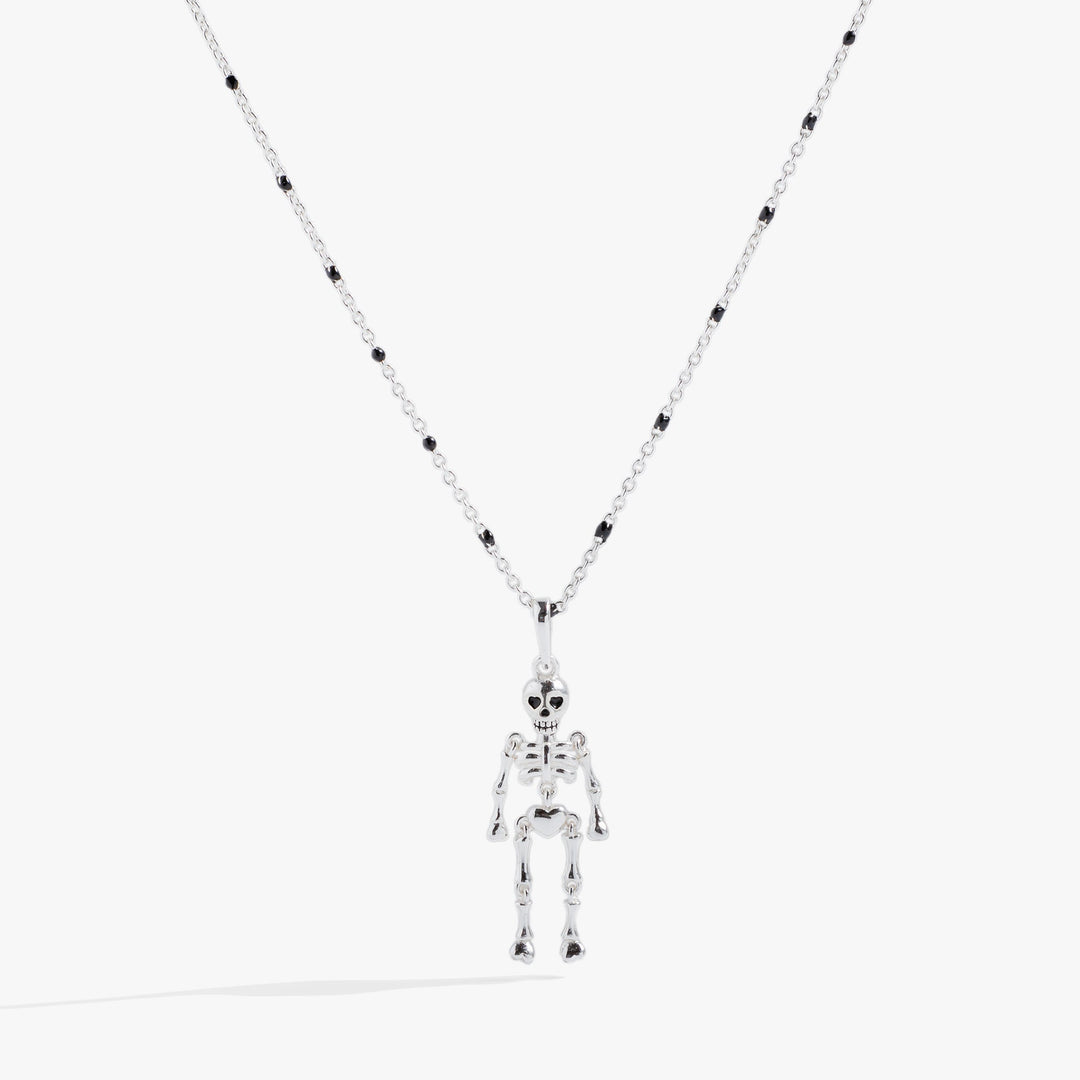 Skeleton pendant necklace on a white background