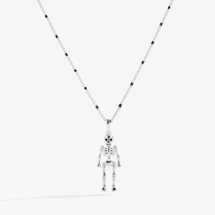 Skeleton pendant necklace on a white background